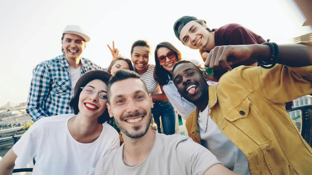 A diverse group of friends taking a selfie outdoors, illustrating local customs and cultural etiquette